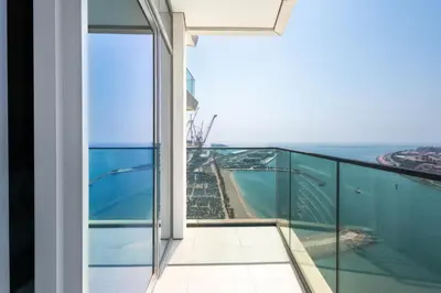 an open balcony with a view of the ocean at Dubai Dream Stay - 2-BR with Sea View in Beach Vista in Dubai