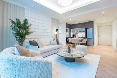 a living room with a couch and a table at Prime 1 Bedroom with Private Beach in Beachfront in Dubai