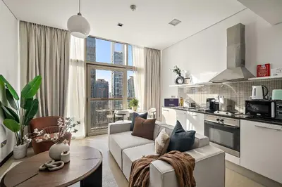 a kitchen and living room with a couch and a table at Silkhaus Gamer's Dream Studio in Liberty House in Dubai