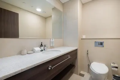 a bathroom with a sink and a toilet at Luxury 2BHK Sea & Palm Views 20th Floor Tram line in Dubai