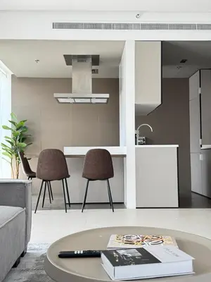 a living room with a table and two chairs at One bedroom Apartment in Dubai Marina next to the Marina Mall in Dubai