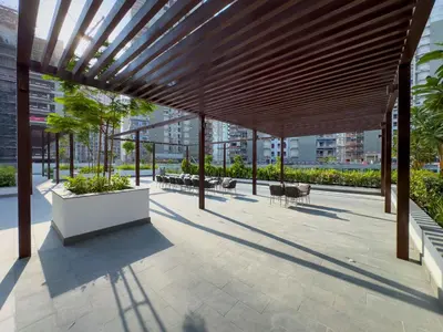 a pavilion with tables and chairs on a building at New Charming 2BR with Gym & Pool in Azizi Riviera in Dubai