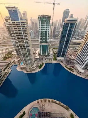 an aerial view of a city with tall buildings at The Greendoor - Lake and Sea View, JLT in Dubai