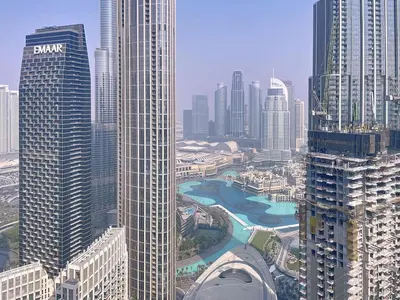 an aerial view of a city with tall buildings at Locations l Chic 3 Bedroom l Burj and Fountain Views l Downtown Dubai in Dubai