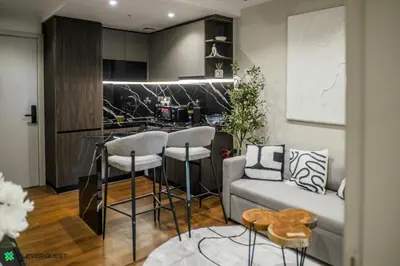 a living room with a couch and a kitchen at Clever Guest 031 Dubai Gate 2 in Dubai