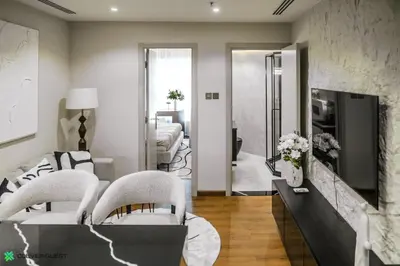 a living room with a couch and chairs and a tv at Clever Guest 031 Dubai Gate 2 in Dubai