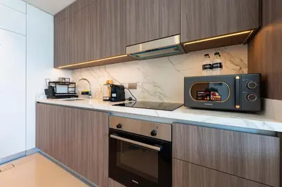 a kitchen with a microwave sitting on a counter at TRPS - Beach Vista, Dubai Harbour - Ain Dubai View, Furnished, Private Beach Access in Dubai