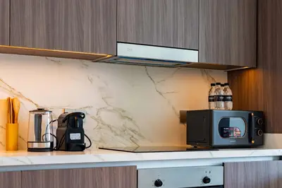 a microwave sitting on a counter in a kitchen at TRPS - Beach Vista, Dubai Harbour - Ain Dubai View, Furnished, Private Beach Access in Dubai