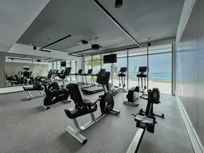 a gym with a lot of exercise equipment in a building at TRPS - Beach Vista, Dubai Harbour - Ain Dubai View, Furnished, Private Beach Access in Dubai