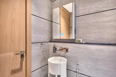 a bathroom with a sink and a mirror at Luxury-Comfort & Elegance Studio in Dubai