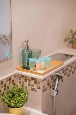 a bathroom counter with three cups and a sink at 2BhK Big Balcony&Canal View Waterfront dubai mall in Dubai
