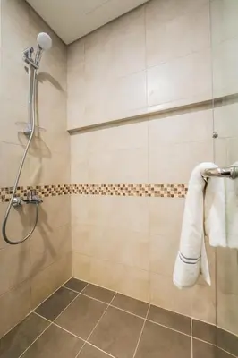 a bathroom with a shower with a towel at 2BhK Big Balcony&Canal View Waterfront dubai mall in Dubai