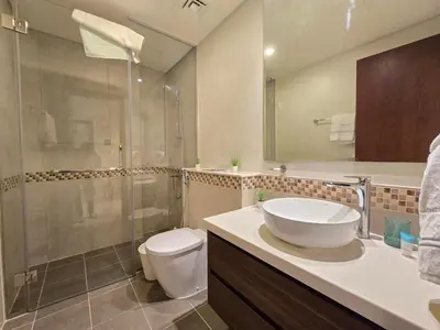 a bathroom with a sink and a toilet and a shower at 2BhK Big Balcony&Canal View Waterfront dubai mall in Dubai