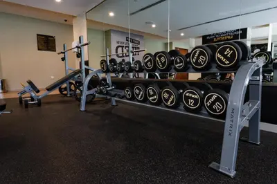a gym with a rack of dumbbells at 2BhK Big Balcony&Canal View Waterfront dubai mall in Dubai