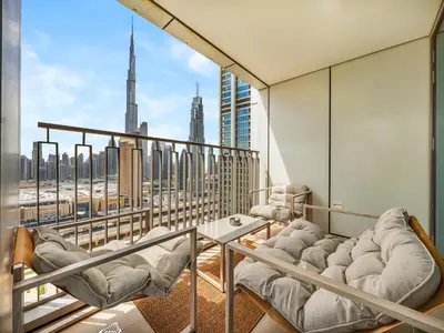 a balcony with a view of the city at Downtown 4BDR Apartment Opposite Dubai Mall, Burj Khalifa Views in Dubai