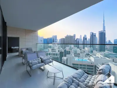 a living room with a view of a city at Luxury 2B with Balcony & Jaccuzi in Business Bay in Dubai