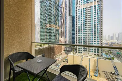 a balcony with a table and chairs and a view of a city at Dubai Marina Marina Heights 2 beds Sleeps 4 in Dubai