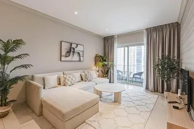 a living room with a couch and a table at Dubai Marina Marina Heights 2 beds Sleeps 4 in Dubai