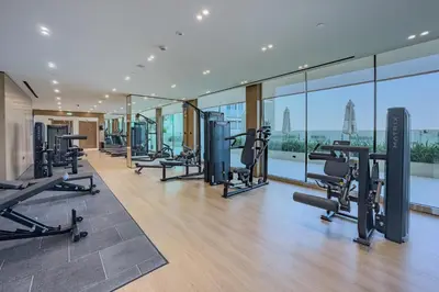 a gym with treadmills and cardio equipment in a building at Studio with Community Views, Steps from Circle Mall and Parks, Near Jebel Ali Racecourse, Binghatti Azure, JVC by Deluxe Holiday Homes in Dubai