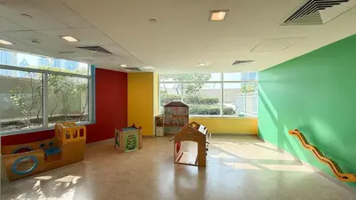 a childs room with a play room with colorful walls at Luxe 2 Bed with Burj View, 5 Min Walk to Dubai Mall, PS5 by Vista Stays Dubai Downtown in Dubai