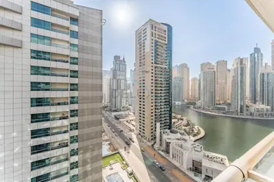 a view of a city skyline with tall buildings at Easy Metro and Tram Access 1BR, Offering Partial Canal, SZR, and City Views, Just Minutes from Marina Mall, Marina Diamond 6, Dubai Marina by Deluxe Holiday Homes in Dubai