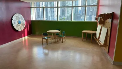 a room with two tables and chairs in a building at Downtown Dubai Beautiful Upgraded 1-bedroom apartment in Dubai