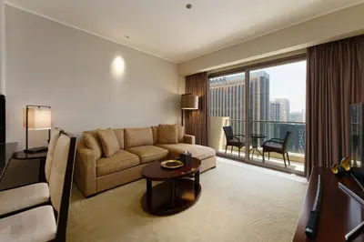 a living room with a couch and a table at Daniels 1BR at JW Marriott with Marina View in Dubai