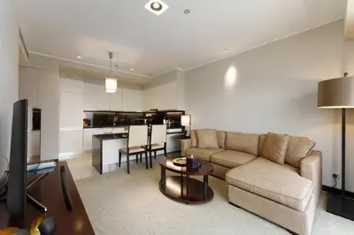 a living room with a couch and a table at Daniels 1BR at JW Marriott with Marina View in Dubai