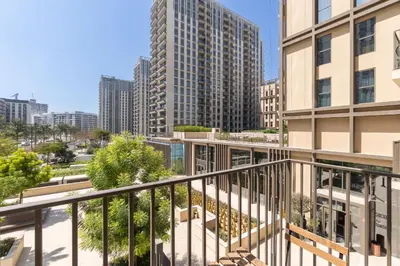 an apartment balcony with a view of buildings at StayShort - Dubai Hills sleeps 4 in a Great Location in Dubai