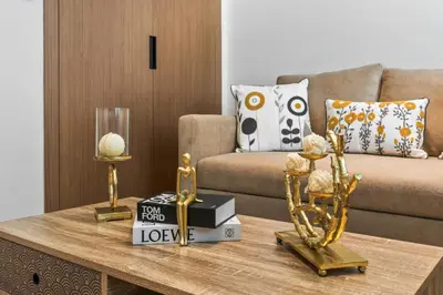 a living room with a couch and a coffee table at luxury Madrid Studio-Binghatti Azure in Dubai