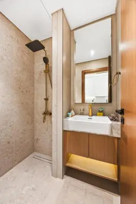 a bathroom with a tub and a sink at luxury Madrid Studio-Binghatti Azure in Dubai