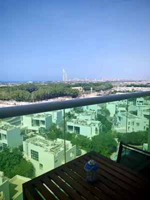 a view of the city from the balcony of a building at Fully Furnished Studio Hilliana Tower Sea View and Burj View in Dubai