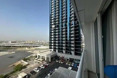 a view of a tall building with a parking lot at Movenpick Apartment JLT in Dubai