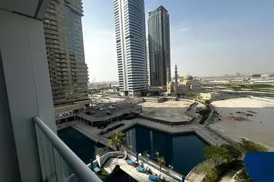 a view of a city from a balcony of a building at Movenpick Apartment JLT in Dubai
