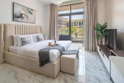a bedroom with a large bed and a large window at Frank Porter - Jwelz Residence in Dubai