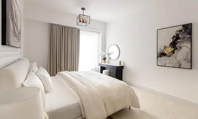 a white bedroom with a bed and a window at Spacious and luxurious 1 bed with amazing marina view!Rimal ! in Dubai