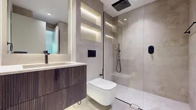 a bathroom with a toilet and a sink and a shower at Vacationer l Modern 1 Bedroom l Aesthetic Interior l Free Wi-Fi in Dubai
