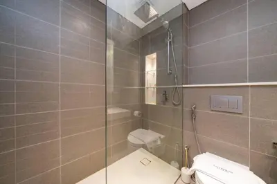 a bathroom with a shower and a toilet at Waterfront Living Bright 1 Bedroom Marina in Dubai