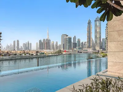 a large body of water with a city in the background at 2BR with M CF7B Partial Canal View in Dubai