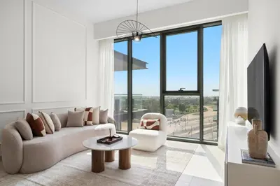 a living room with a couch and a chair at 2BR with M CF7B Partial Canal View in Dubai