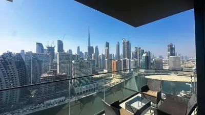 a view of a city skyline from a building at AWS Holiday Homes - Iconic Burj Khalifa Views in Dubai