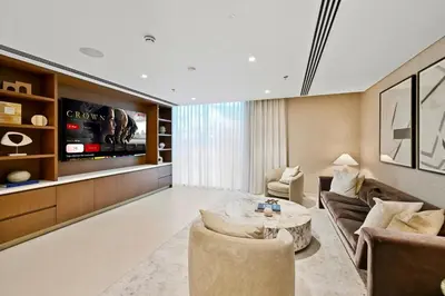 a living room with a couch and a table at Private Beach , Luxury 2BR , Emaar 5-Star Amenities in Dubai