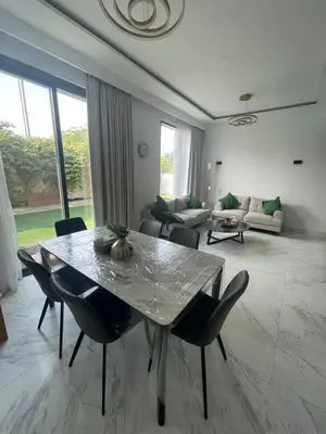a large living room with a table and chairs at Dubai Hills Mahek Holiday Villa in Dubai