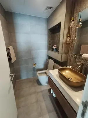 a bathroom with a sink and a toilet at Dubai Hills Mahek Holiday Villa in Dubai