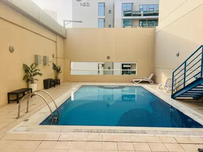 a swimming pool in the middle of a building at Bussinss bay in Dubai