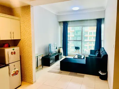 a living room with a couch and a window at Bussinss bay in Dubai