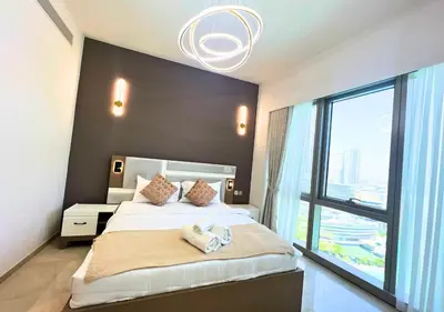 a bedroom with a large bed with a large window at DreamShoma Grande Signature Luxury Full Burj Khalifa & Fountain View in Dubai