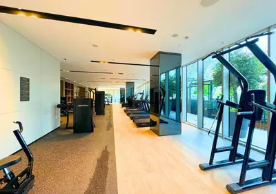 a gym with a row of treadmills in a building at DreamShoma Grande Signature Luxury Full Burj Khalifa & Fountain View in Dubai