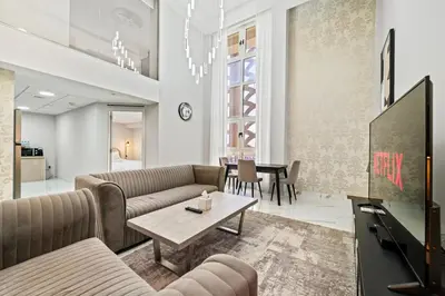 a living room with a couch and a table at Duplex 2BR next to Marina Beach in Dubai