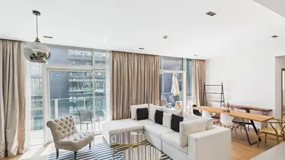 a living room with a white couch and a table at City Walk Building 16, Al Wasl, Jumeirah - Mint Stay in Dubai
